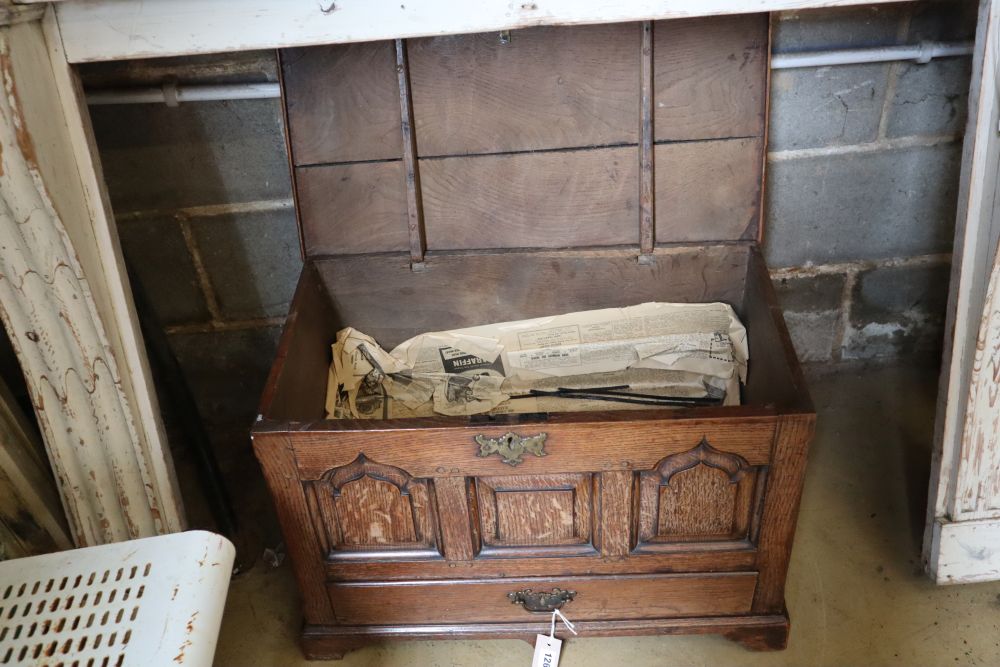 A 19th century oak coffer bach, having detachable planked top over panel front and drawer, width 67cm depth 47cm height 46cm